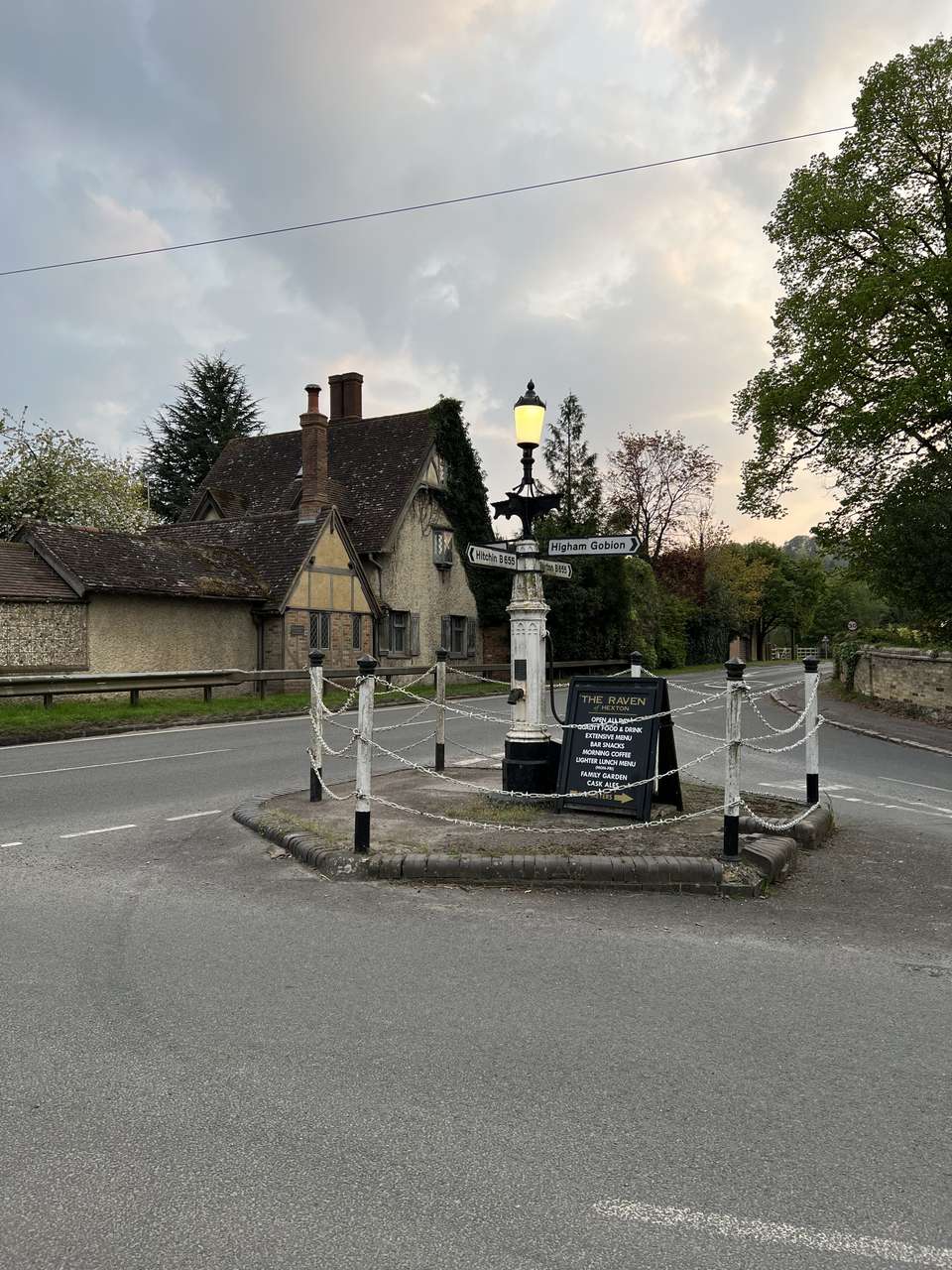 The signpost which doubles as village pump at the crossroads in Hexton
